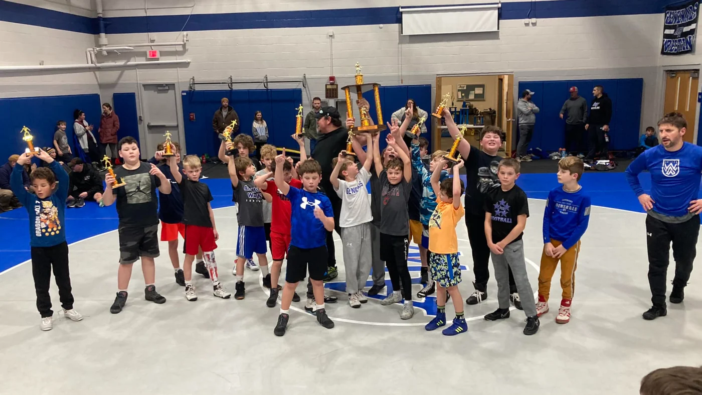 Biddy wrestlers celebrating on the mat